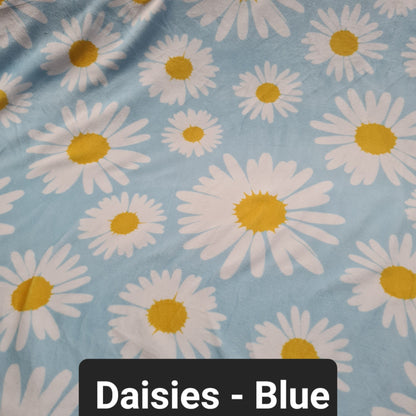 light blue fabric with daisies