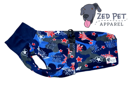 Blue and grey camouflage dog coat with red jets and angels 15 printed on it  and a blue turtleneck on the coat