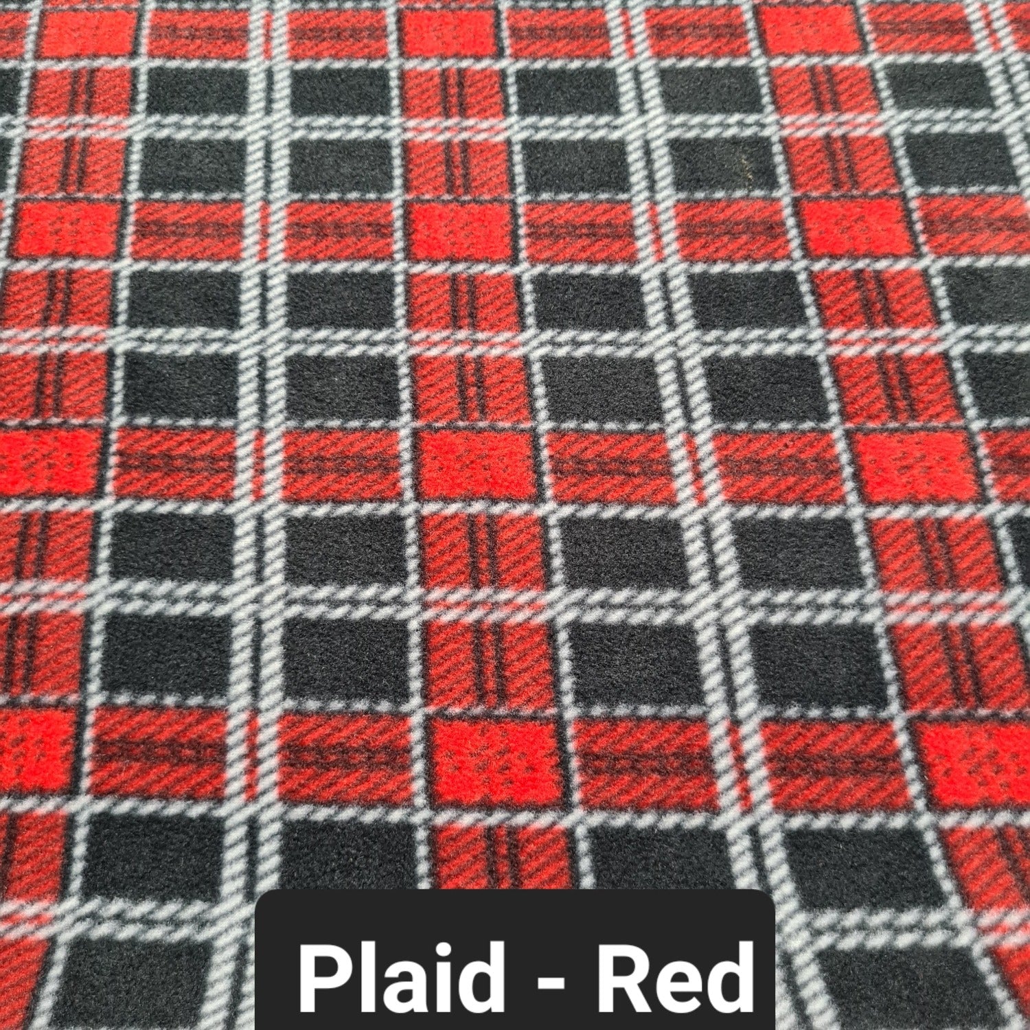 Red and black plaid polar fleece fabric