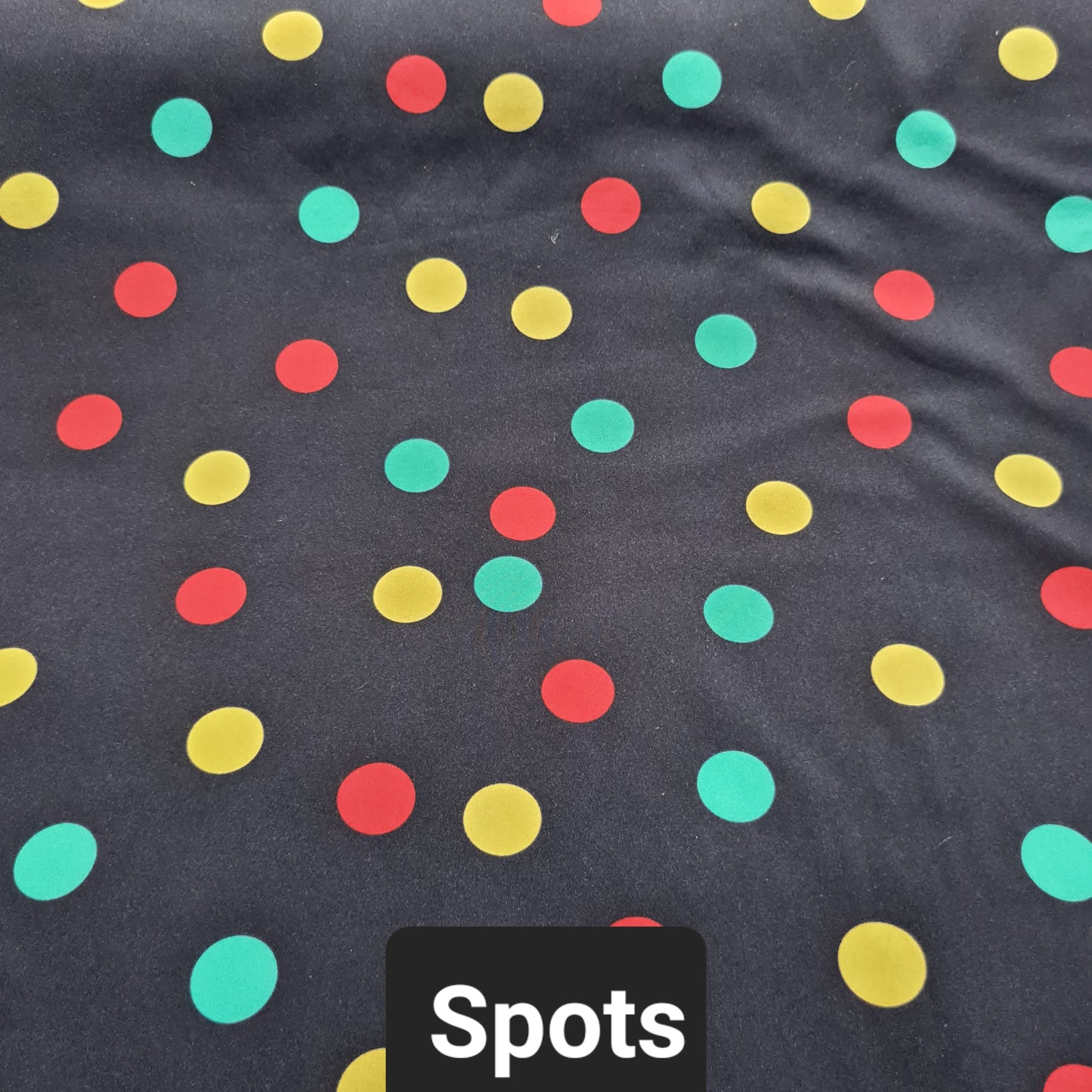 Navy soft shell fabric with green, yellow and red spots