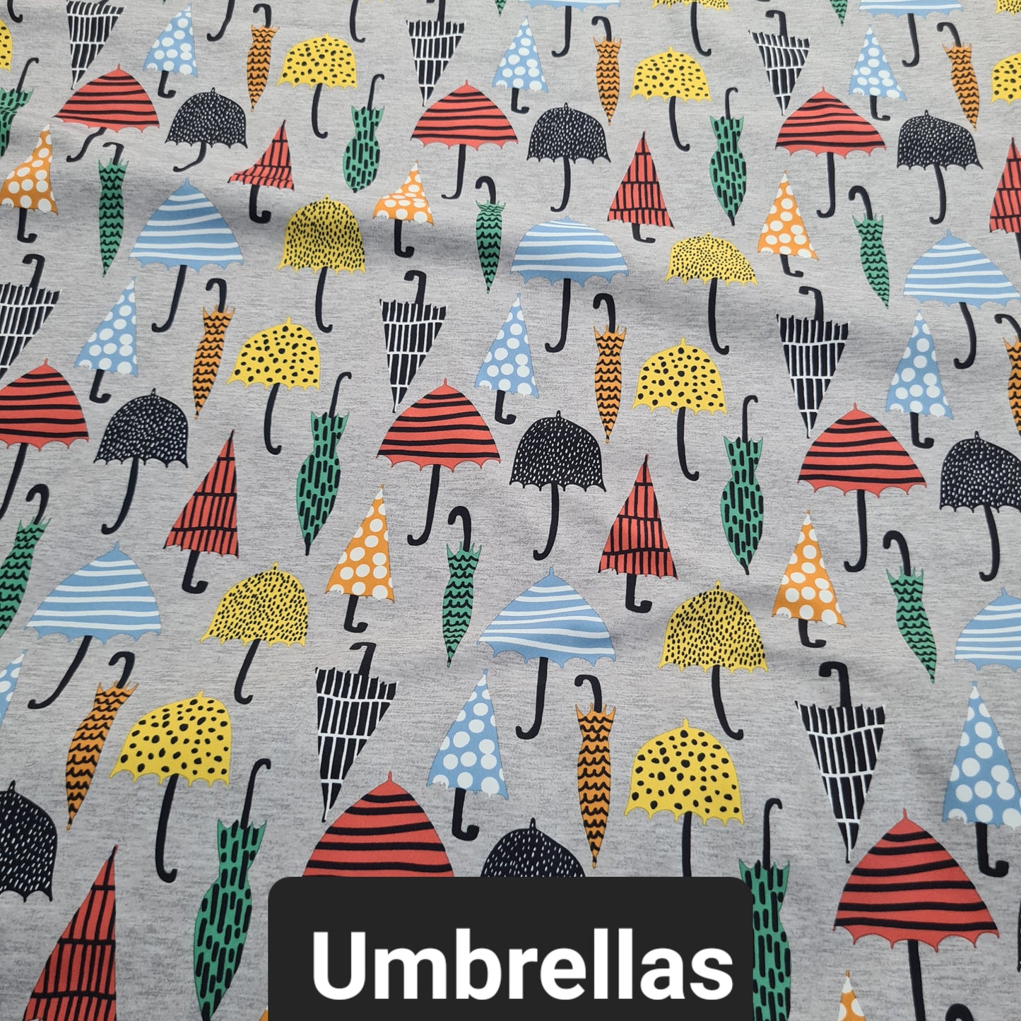 Grey soft shell fabric with colourful umbrellas
