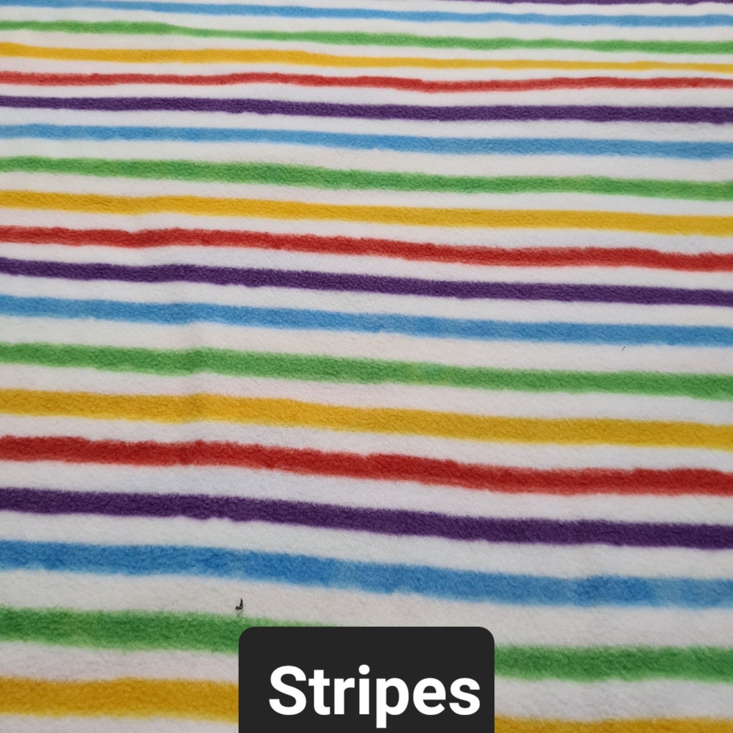 White polar fleece fabric with multicolour stripes