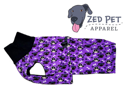 Purple dog coat with dog faces and a black turtlenck